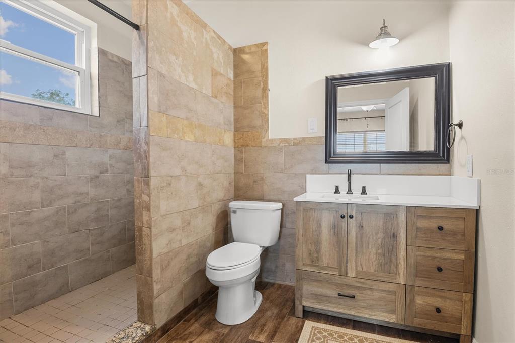 4020 Connersville Road Bartow, FL 33830 - Photo 27 of 50 a bathroom with a toilet sink and mirror