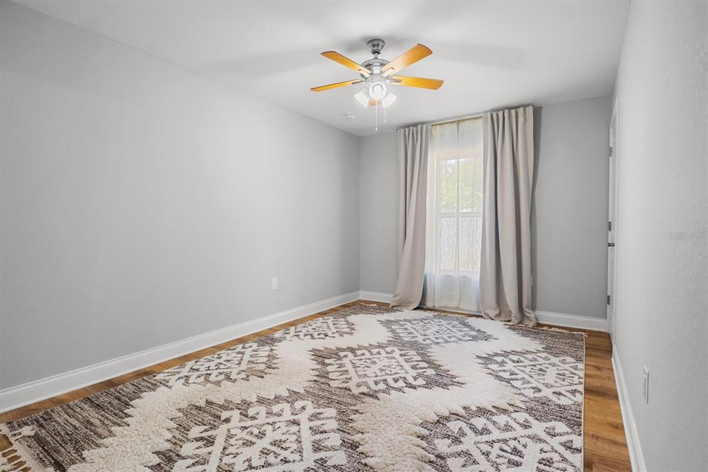4020 Connersville Road Bartow, FL 33830 - Photo 38 of 50 a view of a big room with wooden floor and a window