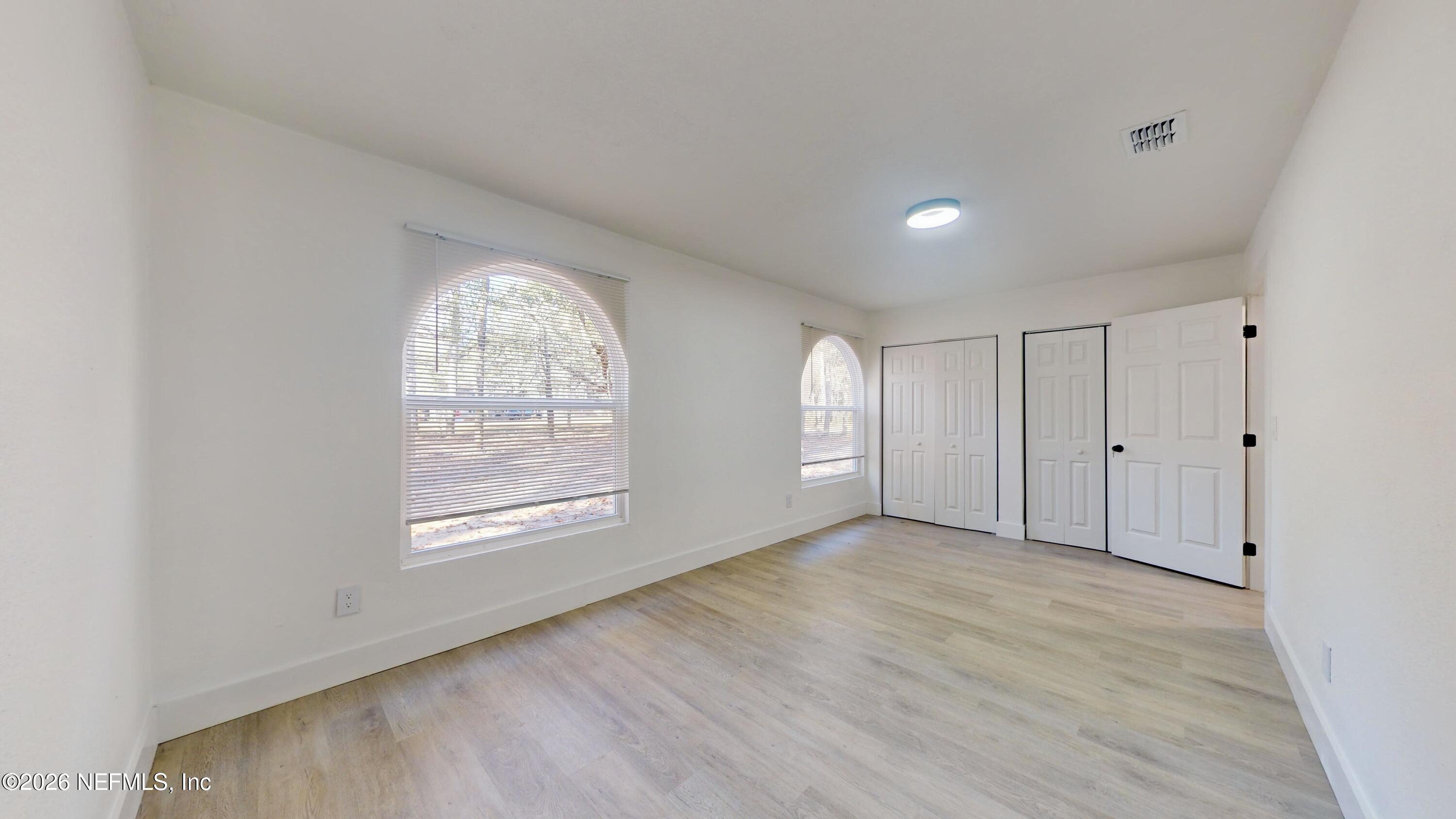 4774 Leopard Circle Middleburg, FL 32068 - Photo 28 of 50 an empty room with windows