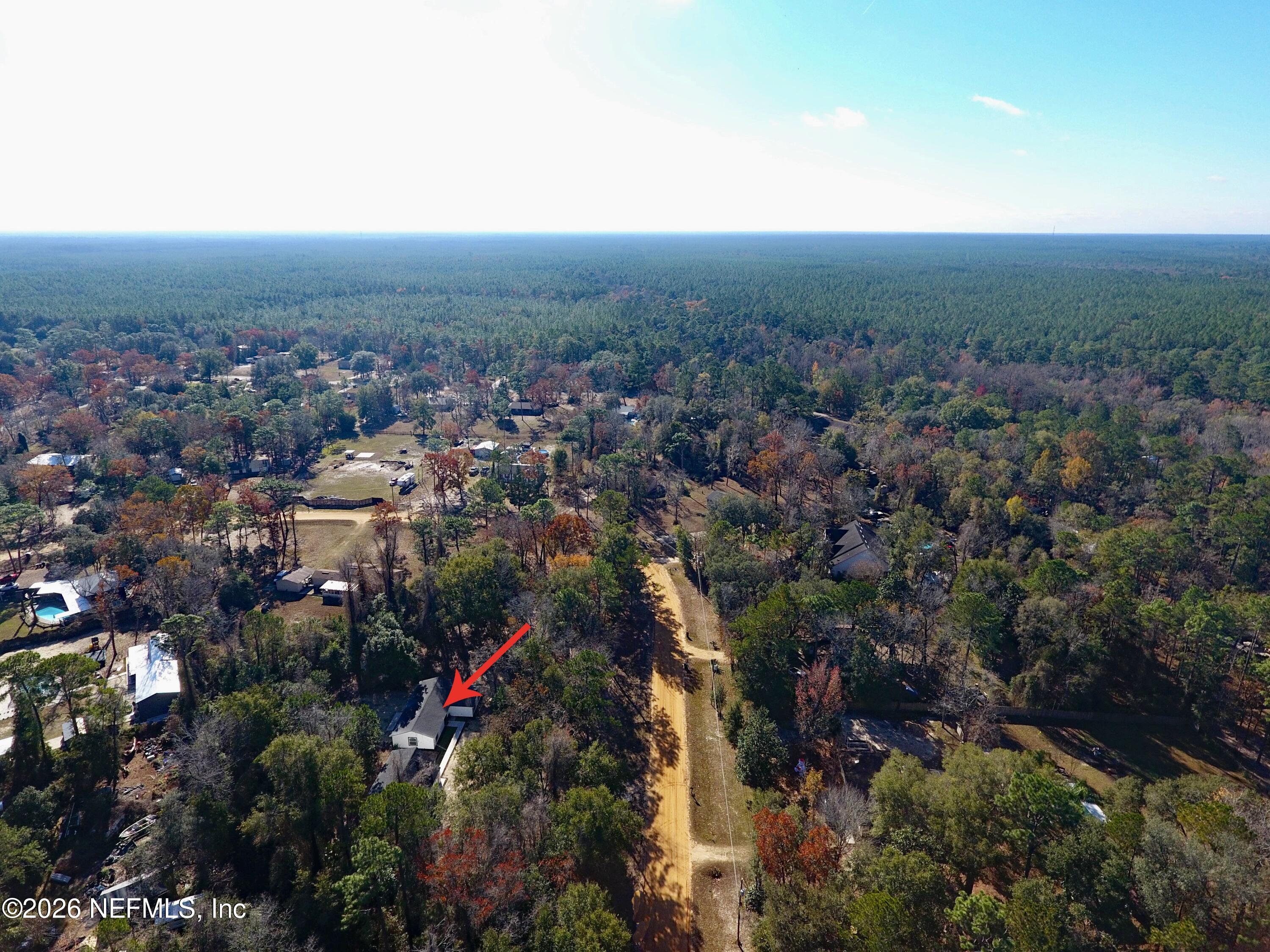 4774 Leopard Circle Middleburg, FL 32068 - Photo 46 of 50 an aerial view of house with yard and mountain view in back