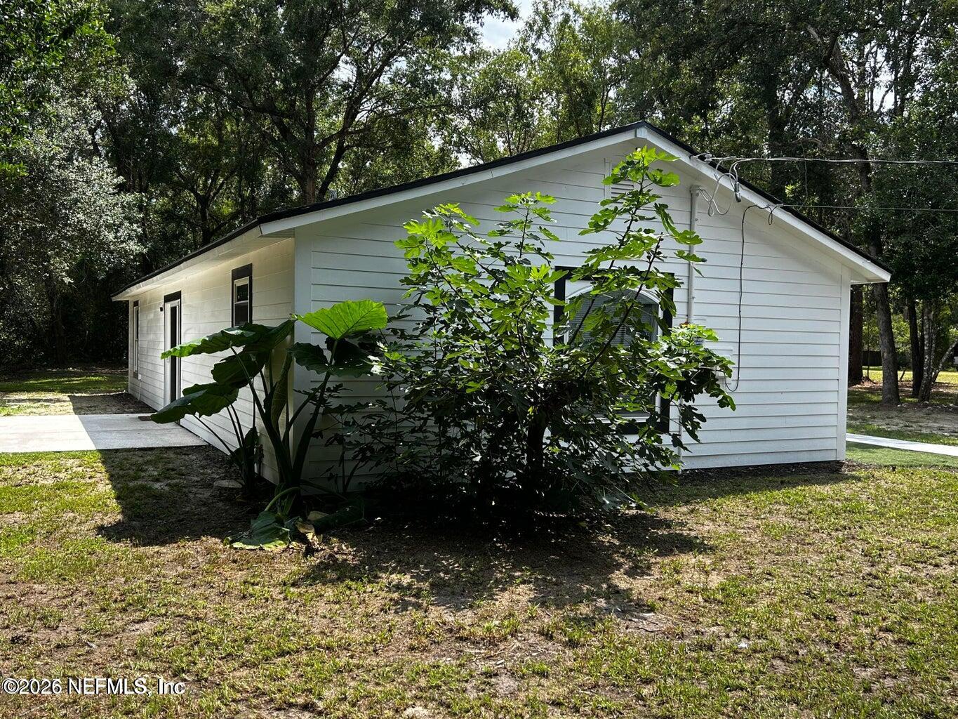 4774 Leopard Circle Middleburg, FL 32068 - Photo 5 of 50 a backyard of a house with lots of green space