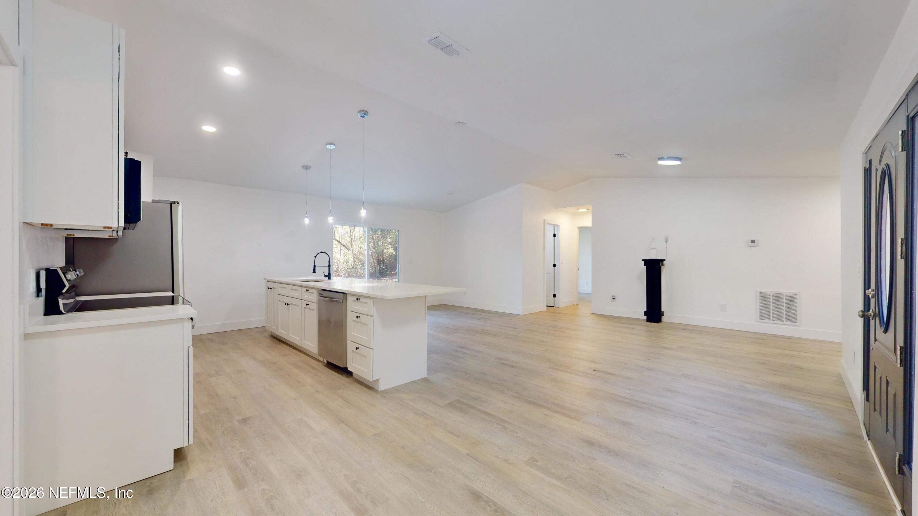 4774 Leopard Circle Middleburg, FL 32068 - Photo 10 of 50 a view of a kitchen with a sink and a stove top oven
