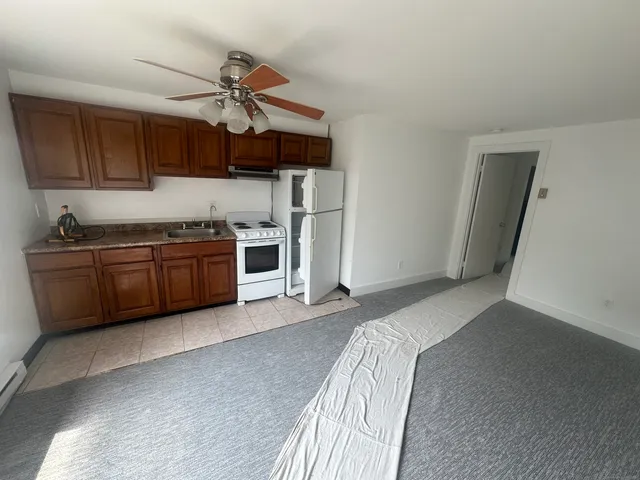 a kitchen with a sink cabinets and stainless steel appliances