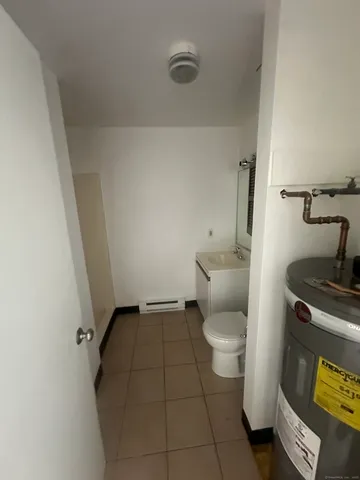 a bathroom with a toilet and a sink