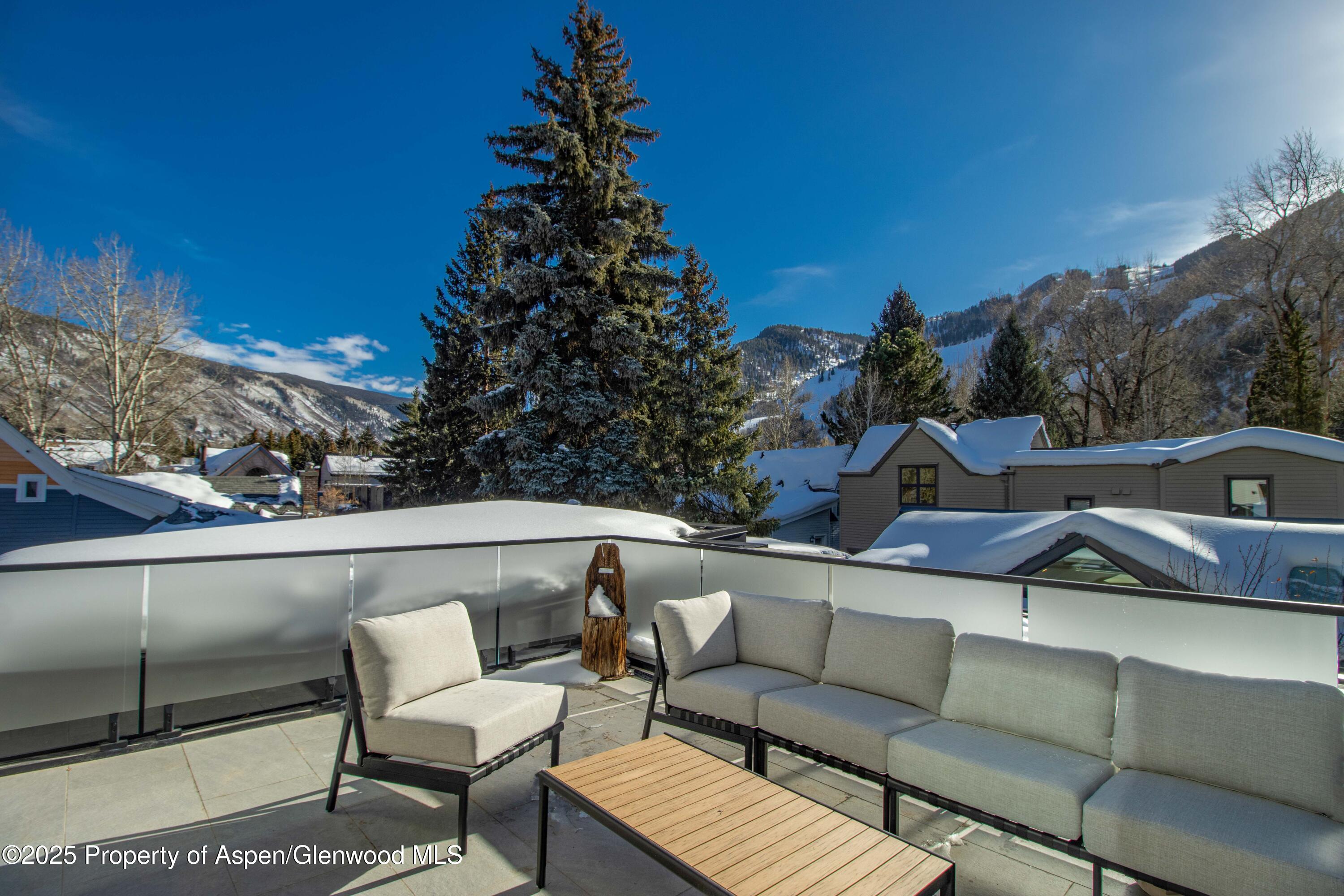 211 West Main Street, Unit 201 Aspen, CO 81611 - Photo 1 of 14 a view of a outdoor seating area