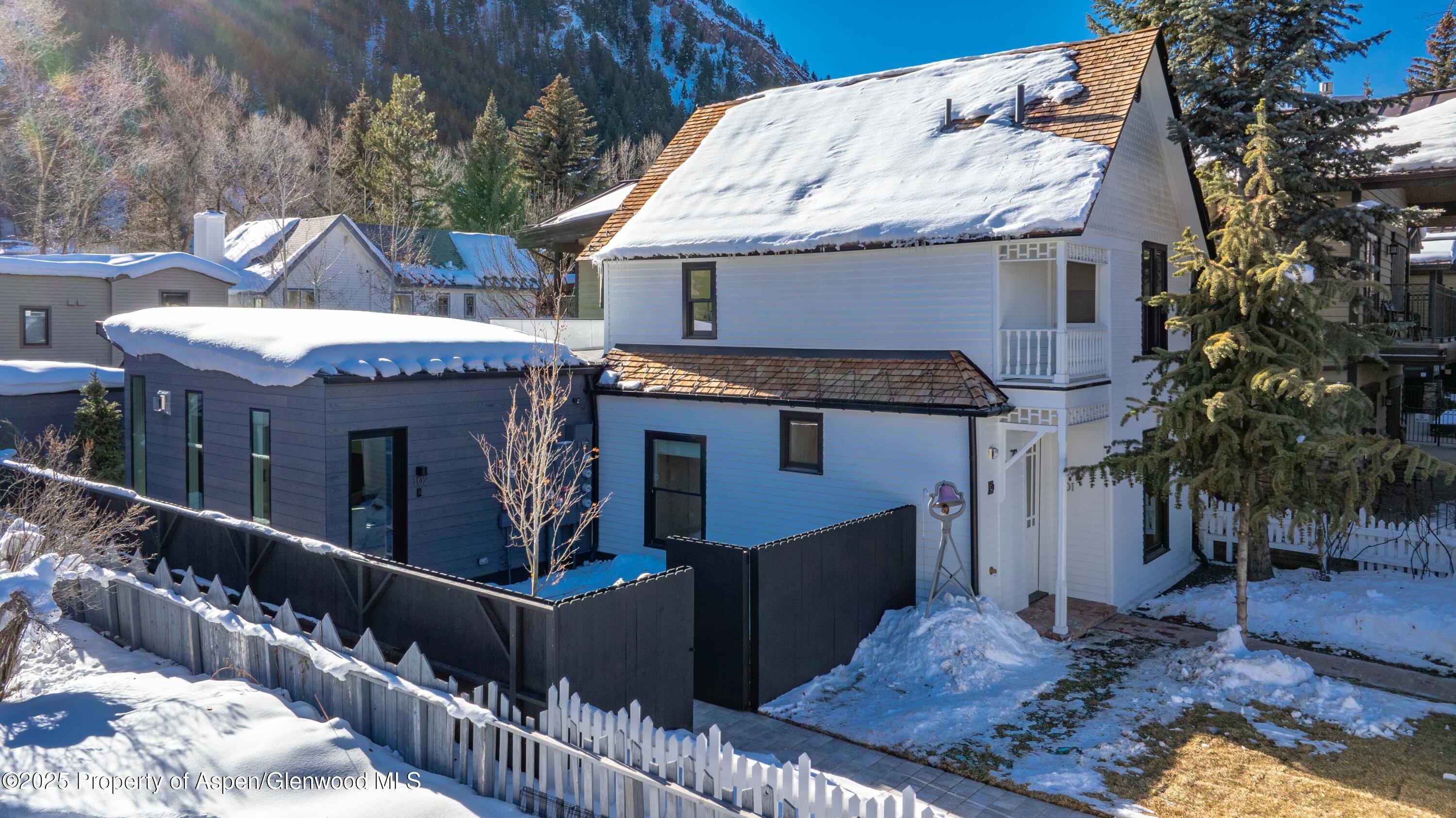 211 West Main Street, Unit 201 Aspen, CO 81611 - Photo 3 of 14 a front view of a house with balcony