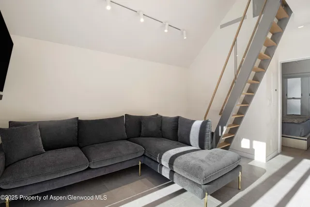 a living room with furniture and a couch