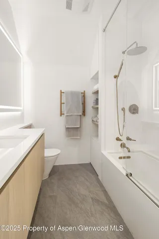 a bathroom with a bathtub sink and toilet