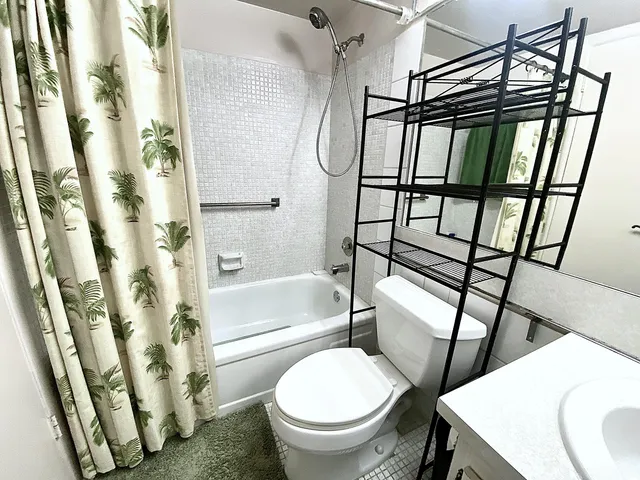 a bathroom with a toilet and a sink