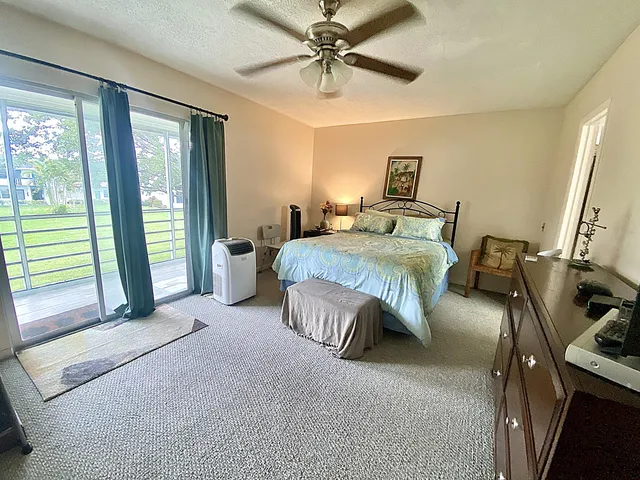 a bedroom with a bed and a table