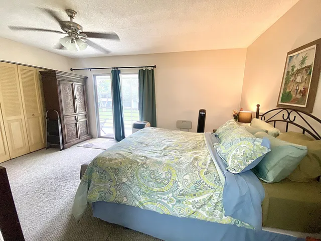 a spacious bedroom with a bed and a couch