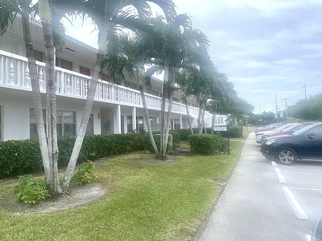 an aerial view of residential houses with outdoor space and river