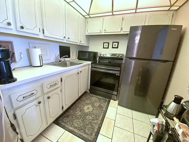 a kitchen with a stove and a microwave