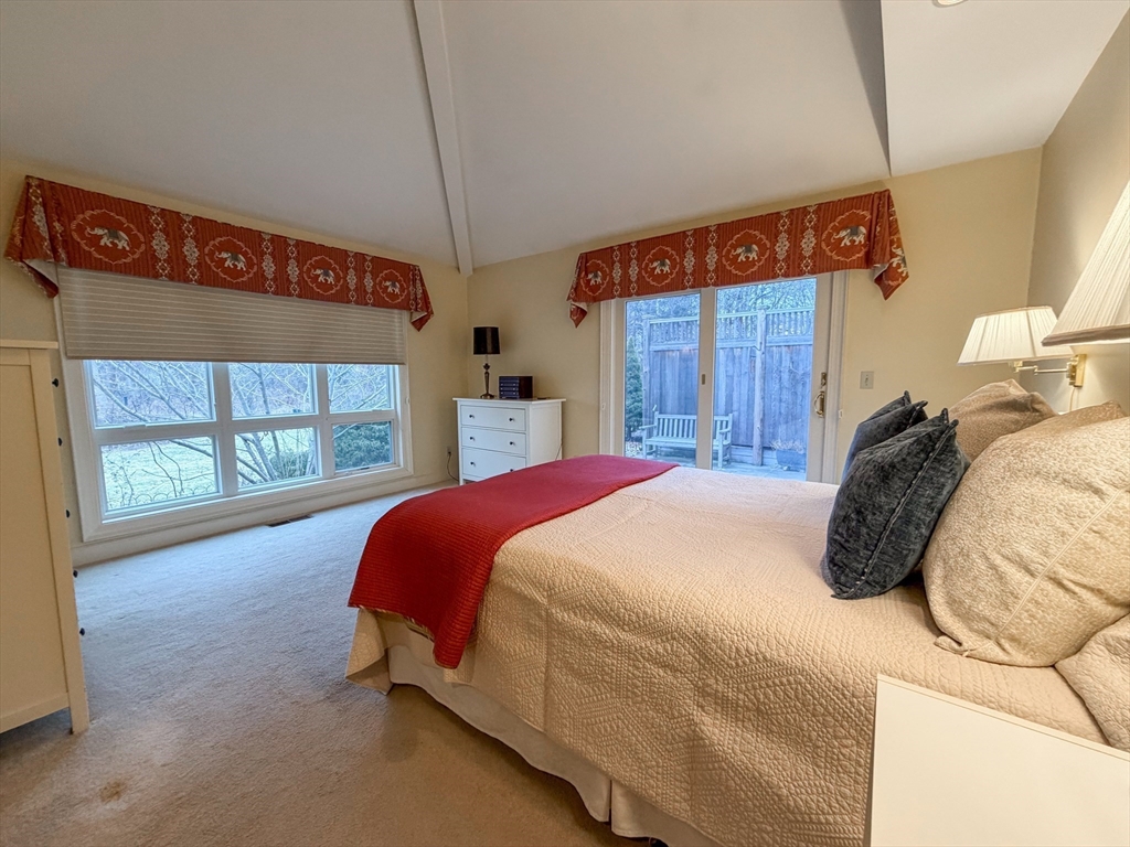 6 Hopewell Farm Road, Unit 6 Natick, MA 01760 - Photo 13 of 18 a bed sitting in a bedroom next to a window