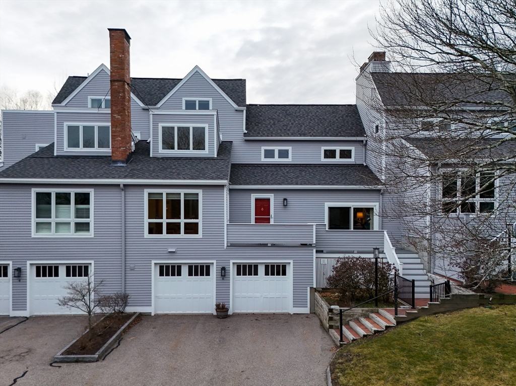 6 Hopewell Farm Road, Unit 6 Natick, MA 01760 - Photo 2 of 18 a front view of a house with a yard