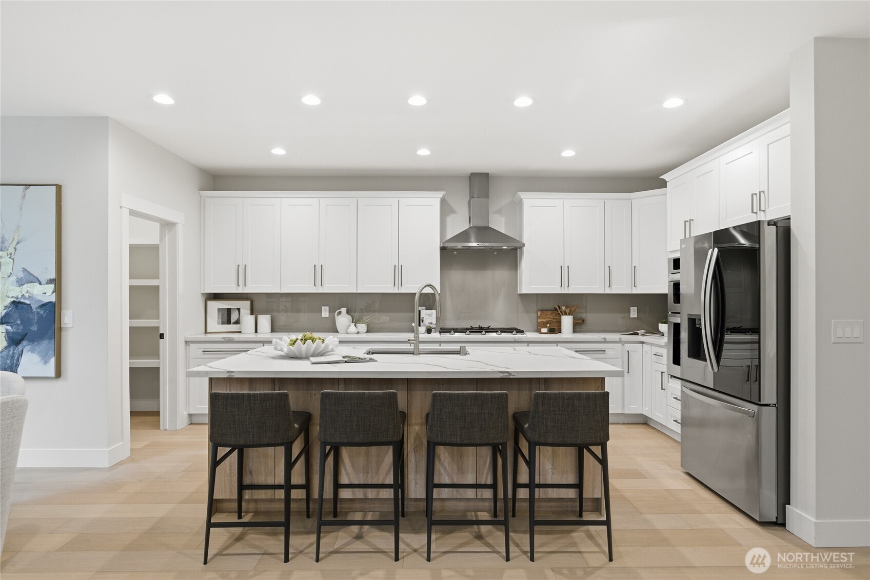 719 Edmonds Way Edmonds, WA 98020 - Photo 12 of 40 a kitchen with stainless steel appliances a table and chairs in it