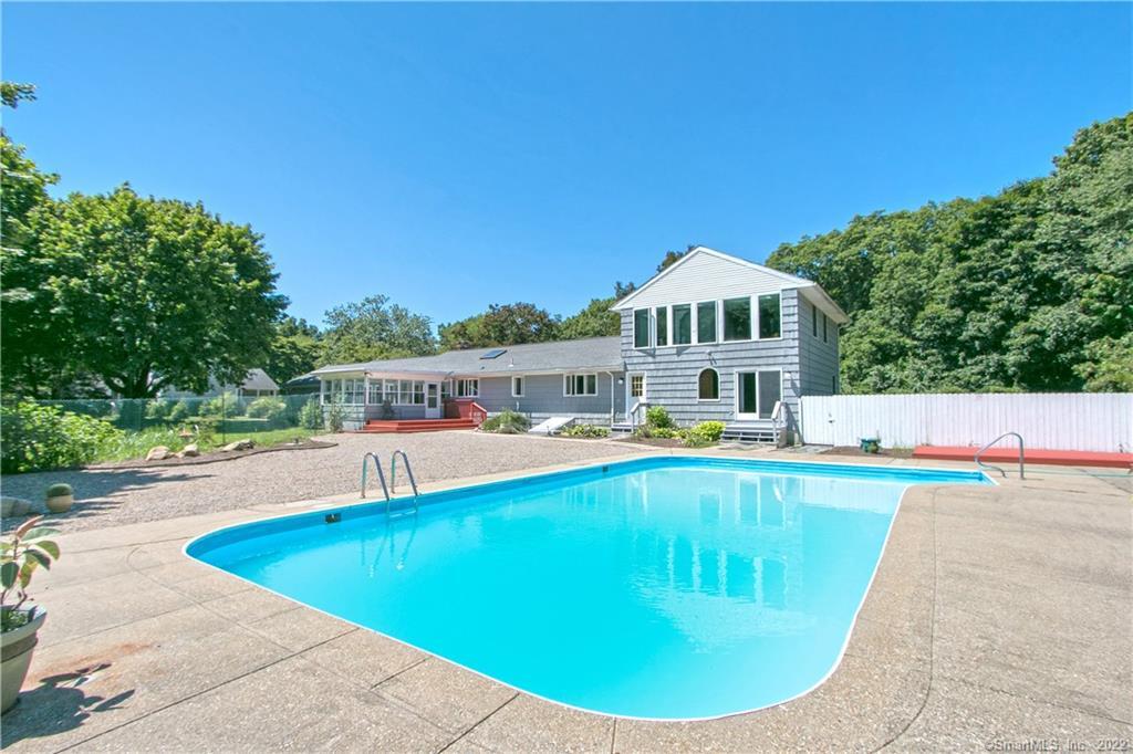 54 Dean Road East Lyme, CT 06333 - Photo 1 of 1 a view of a swimming pool with a patio