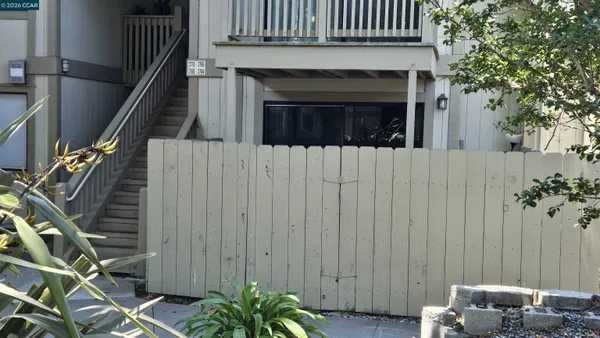 a view of a house with a tree