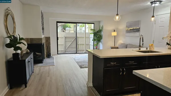 a kitchen with a sink appliances and a counter top space