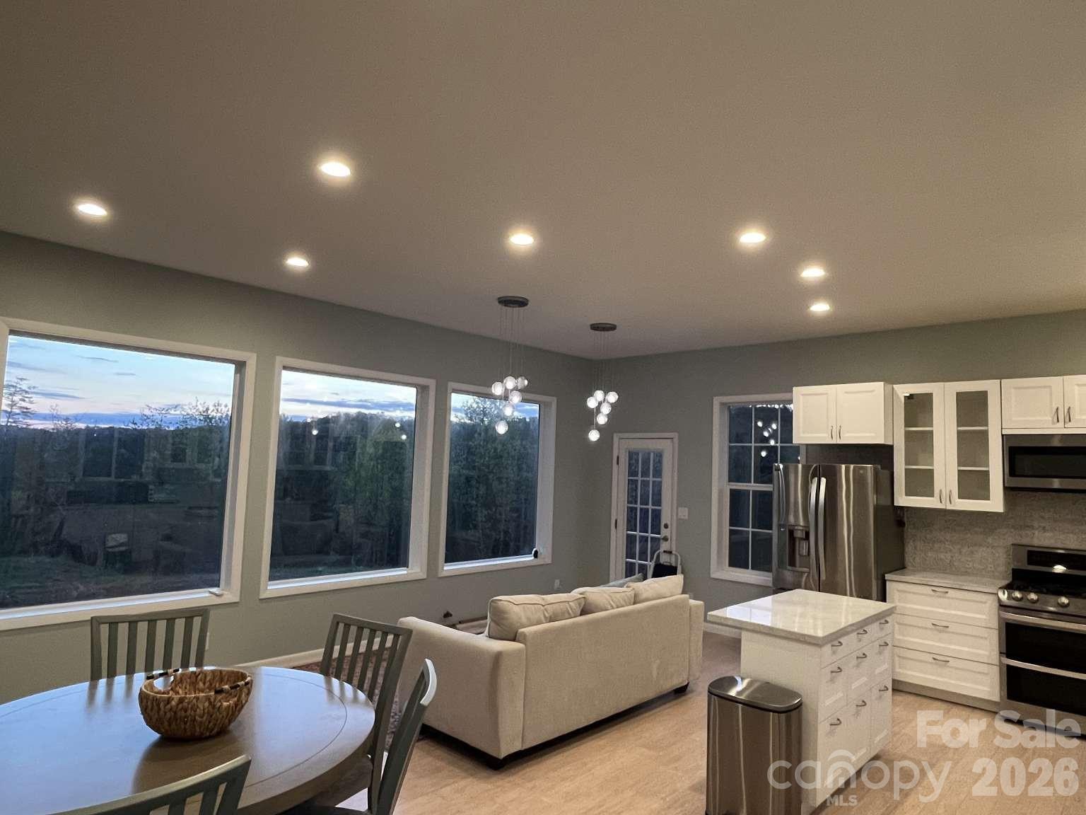 3445 Irish Hills Road Morganton, NC 28655 - Photo 11 of 34 a living room with furniture and a large window
