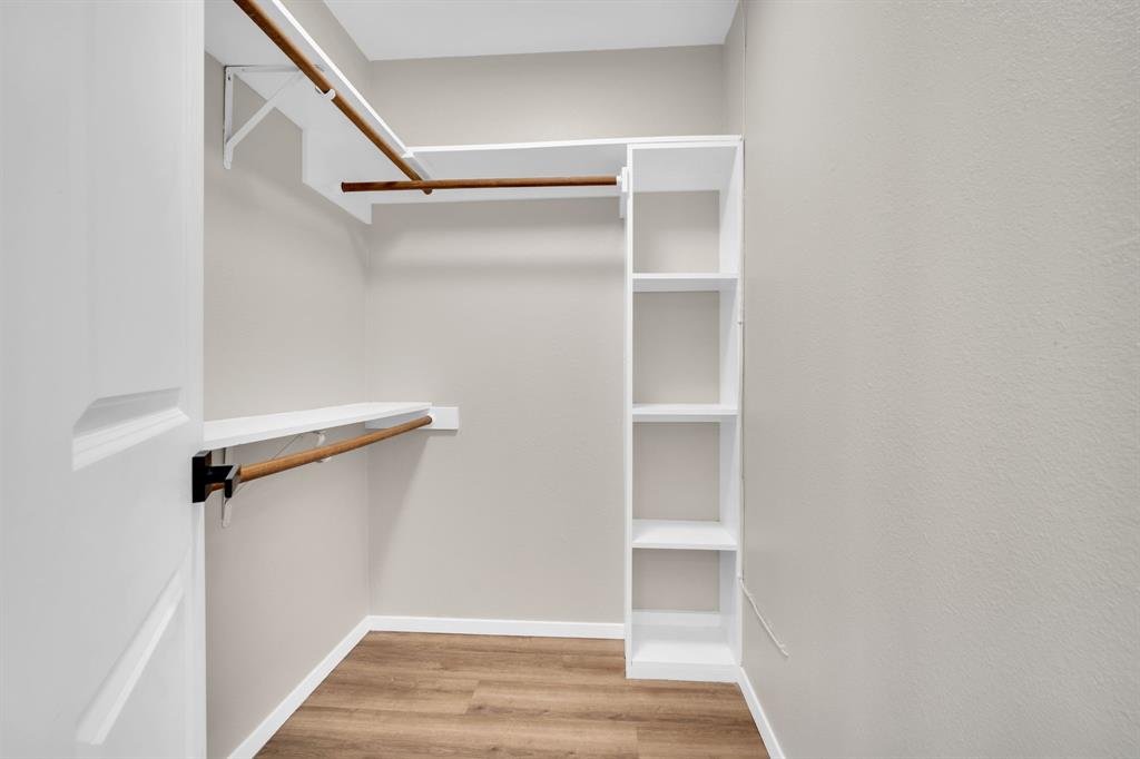 221 North Edgefield Road Waxahachie, TX 75165 - Photo 16 of 27 a view of walk in closet with empty racks