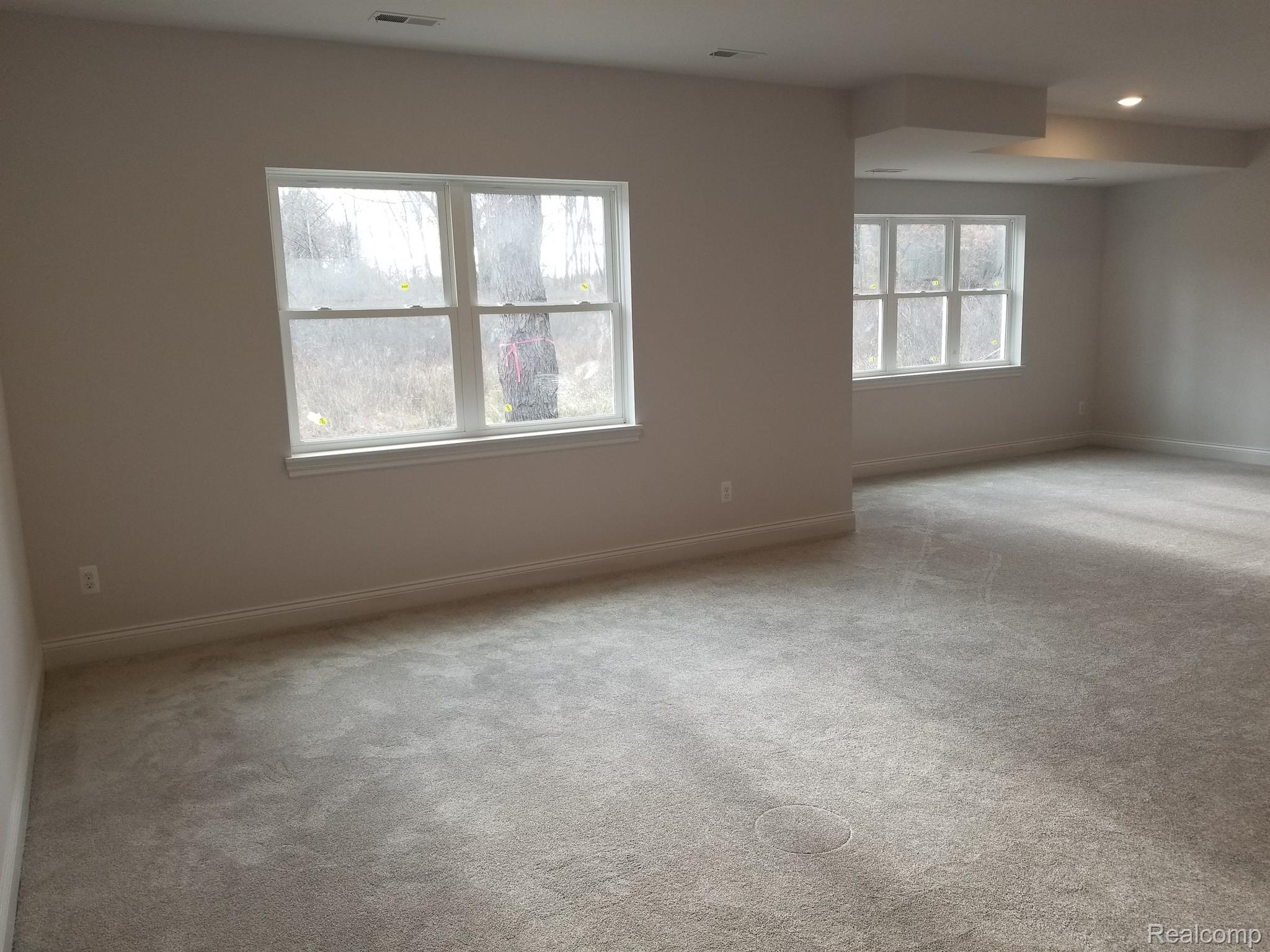 2195 Sundance Ridge Howell, MI 48843 - Photo 21 of 24 HUGE FINISHED REC ROOM IN WALK-OUT BASEMENT