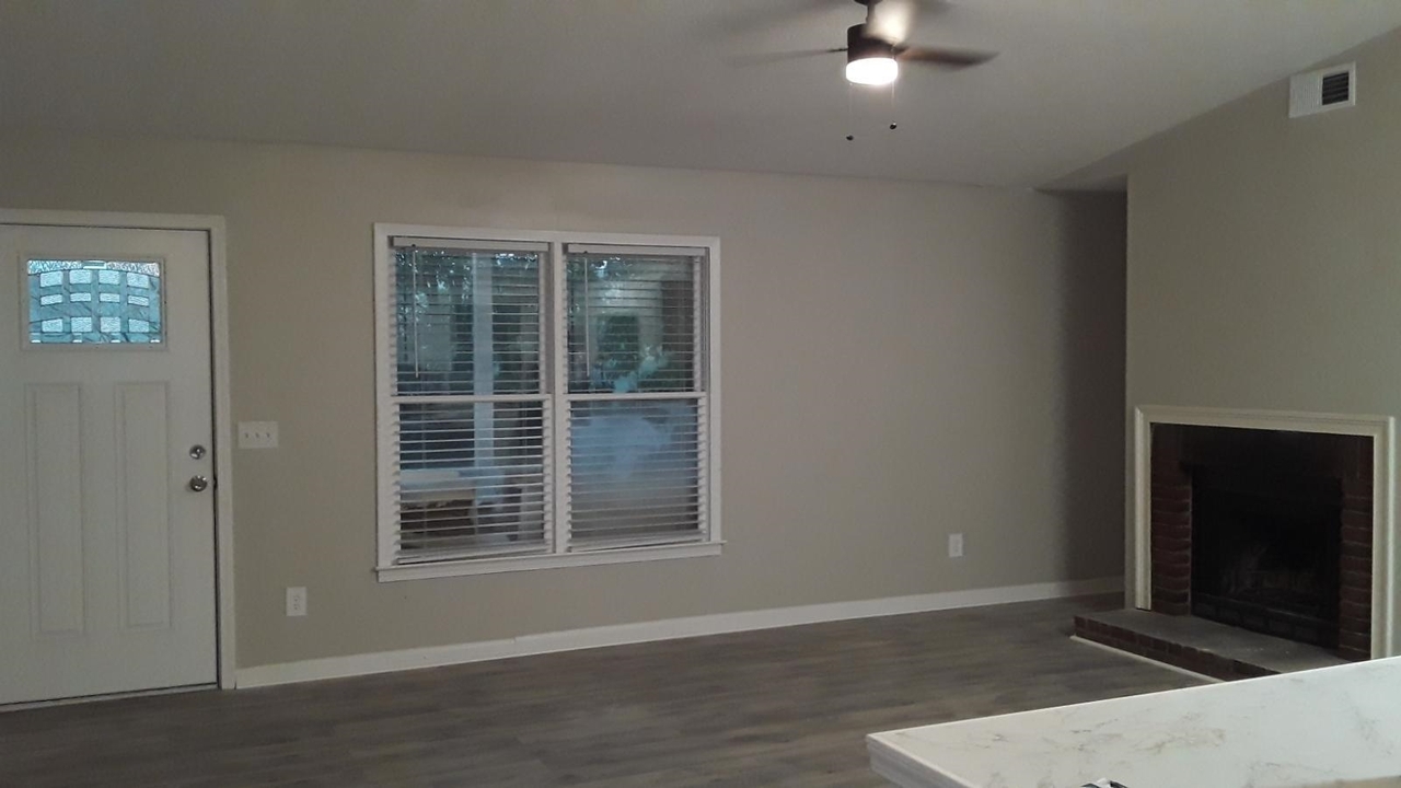 7455 Nebo Road Hiram, GA 30141 - Photo 1 of 1 a view of an empty room with wooden floor and a window