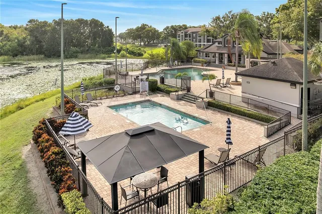 a view of a swimming pool with a patio