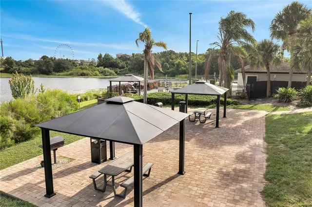 a backyard of a house with table and chairs