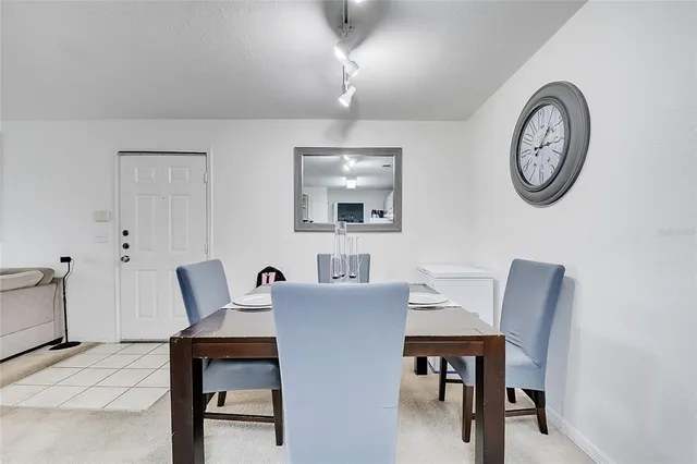 a workspace with furniture and a large window