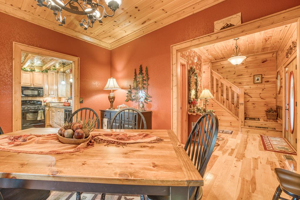 671 Stover Knob Trail Cherry Log, GA 30522 - Photo 14 of 89 a bedroom with a bed and a mirror on the dresser