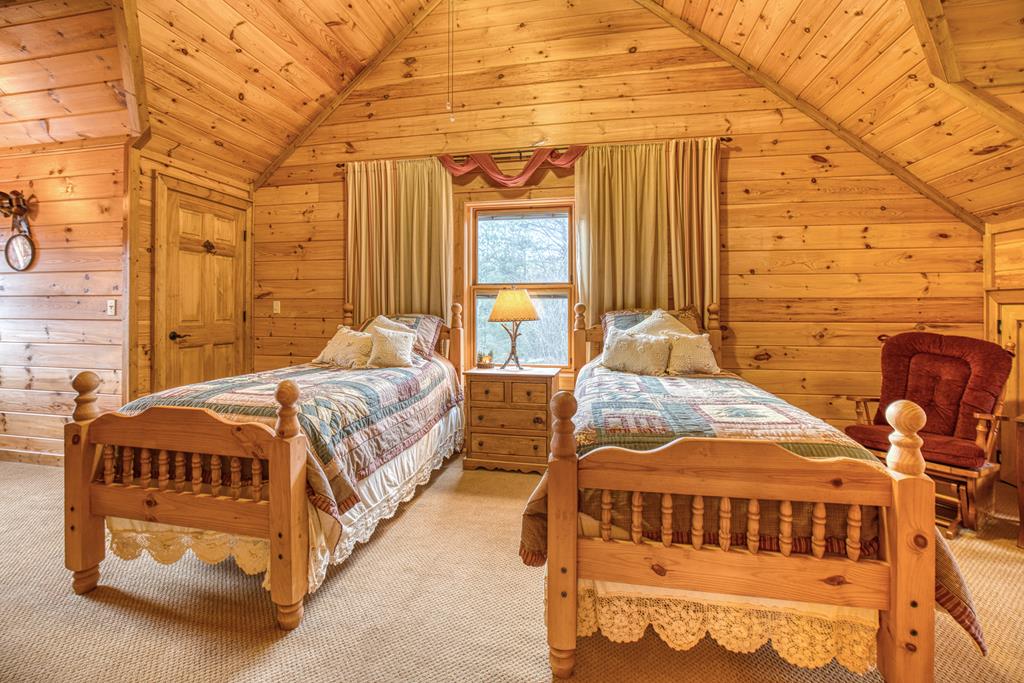 671 Stover Knob Trail Cherry Log, GA 30522 - Photo 34 of 89 a spacious bedroom with two beds and a window