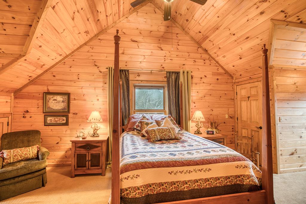 671 Stover Knob Trail Cherry Log, GA 30522 - Photo 39 of 89 a bedroom with a bed and wooden floor