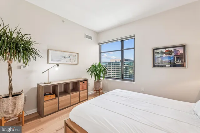 a bedroom with a bed and a bookshelf