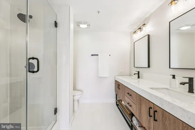 a bedroom with a bed and a chair