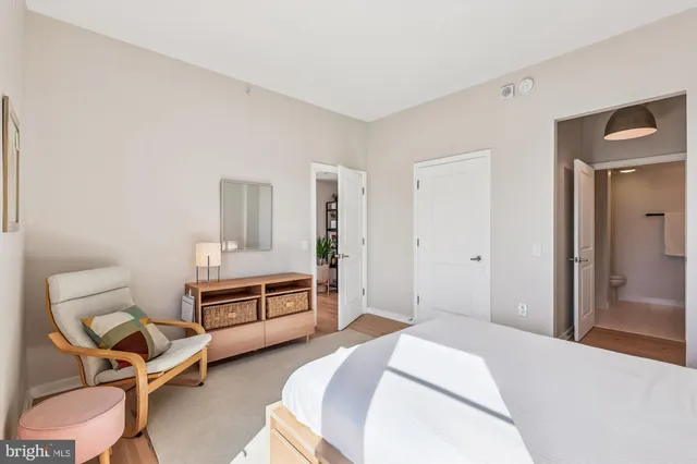 a living room with furniture and white walls