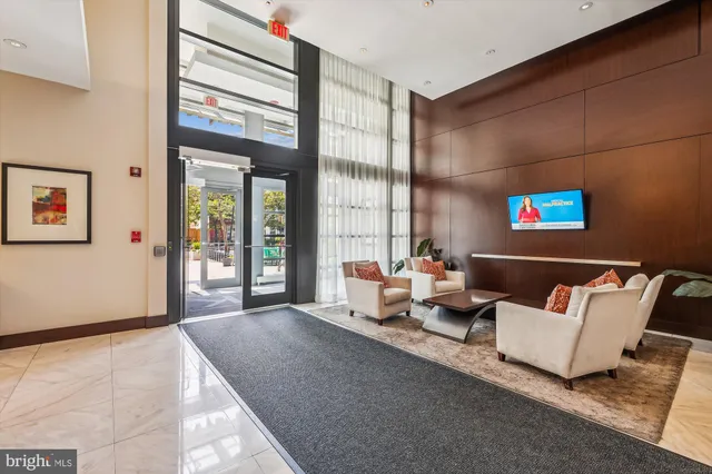 a living room with fireplace furniture and a flat screen tv