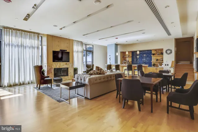 a large white kitchen with cabinets