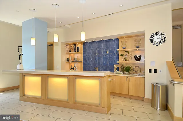 a view of swimming pool with outdoor seating and a couch