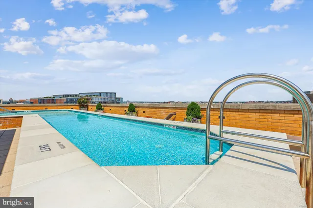a view of a patio with chairs and a potted plant