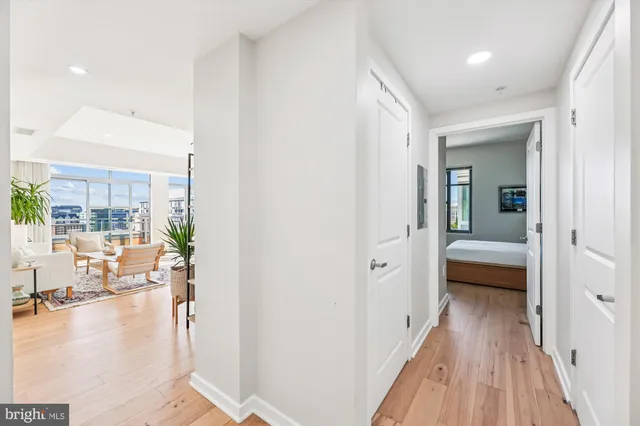 a living room with furniture a large window and a table