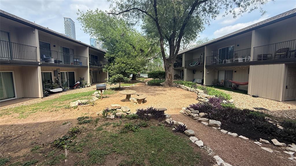 500 East Riverside Drive, Unit 132 Austin, TX 78704 - Photo 20 of 31 a backyard of a house with yard and outdoor seating