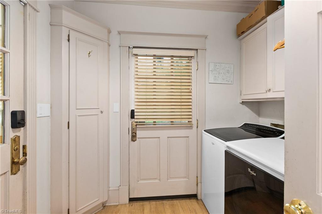 4112 St Johns Street High Point, NC 27265 - Photo 18 of 44 Laundry room with access to garage and outside. Make sure to check out all the storage in the garage.