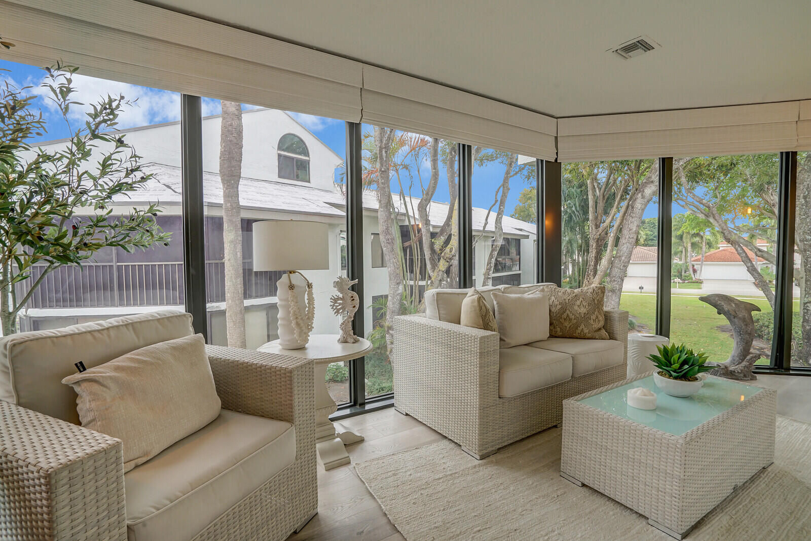 7527 Glendevon Lane, Unit 805 Delray Beach, FL 33446 - Photo 12 of 52 a living room with furniture and a large window