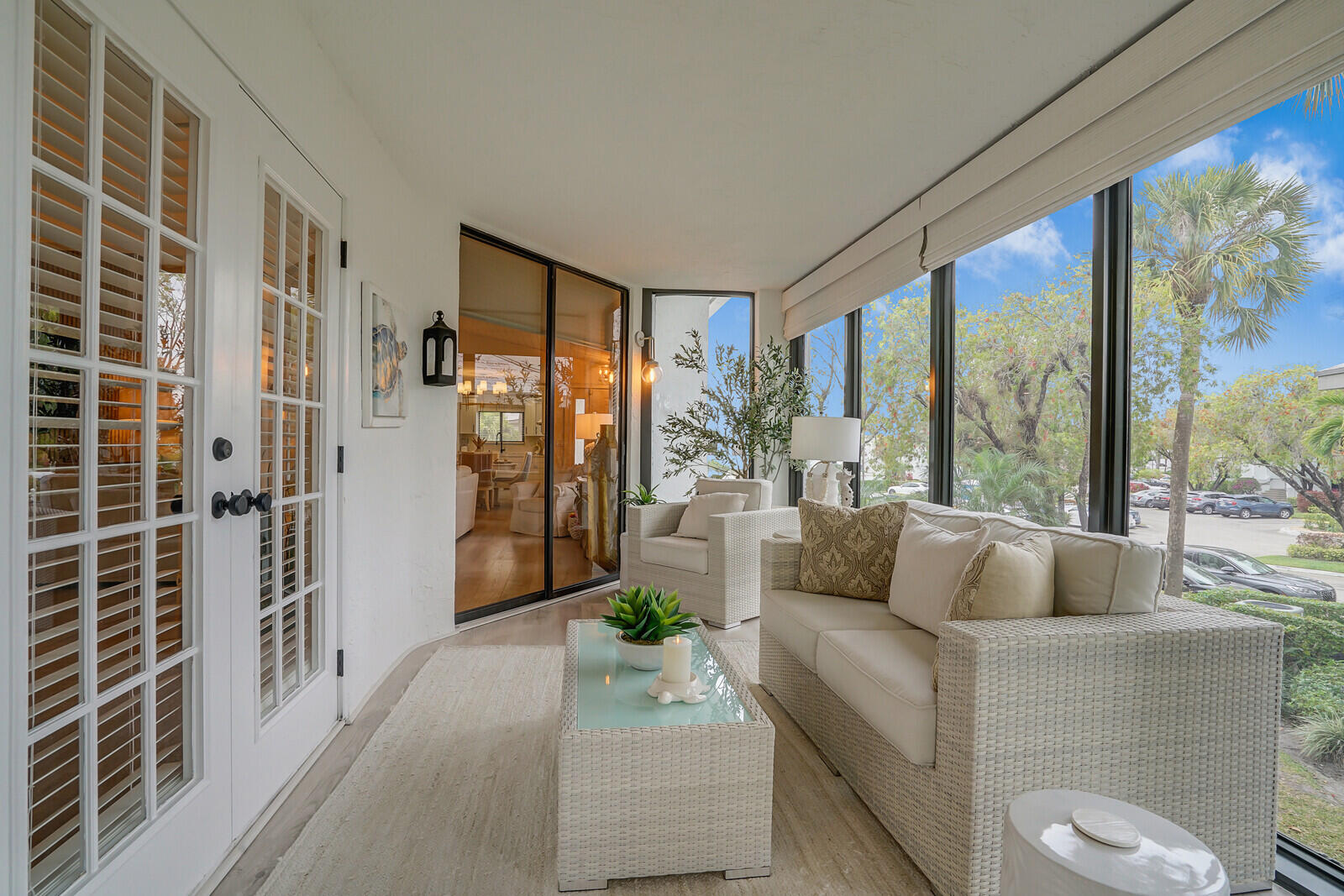 7527 Glendevon Lane, Unit 805 Delray Beach, FL 33446 - Photo 13 of 52 a living room with furniture and large windows