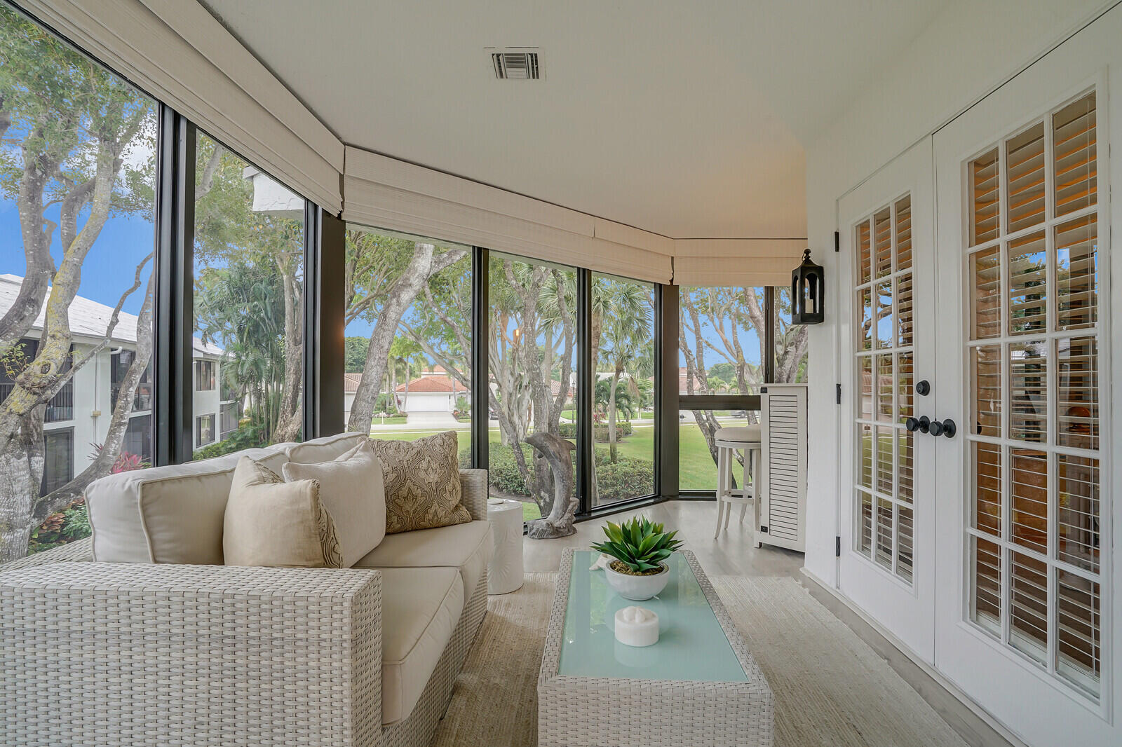 7527 Glendevon Lane, Unit 805 Delray Beach, FL 33446 - Photo 16 of 52 a living room with furniture and a floor to ceiling window