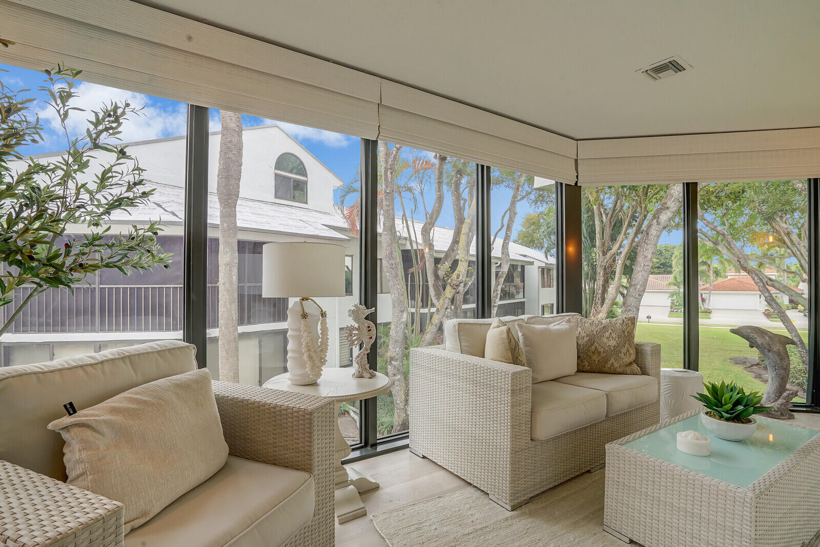 7527 Glendevon Lane, Unit 805 Delray Beach, FL 33446 - Photo 17 of 52 a living room with furniture and a large window