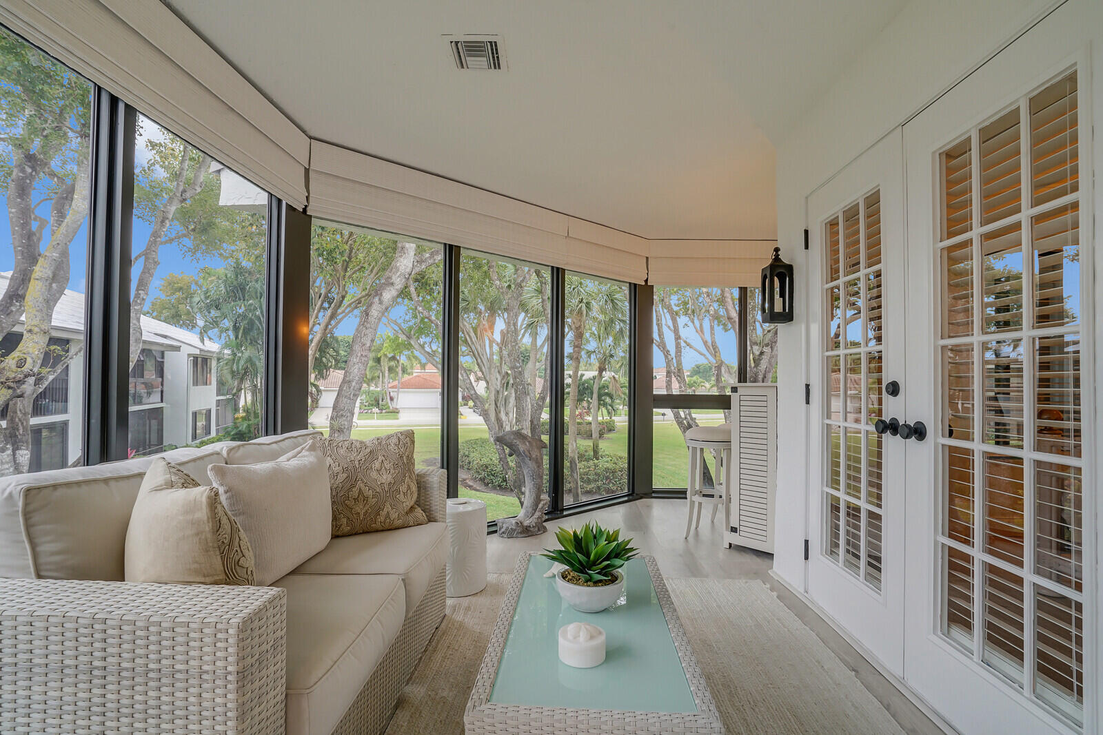 7527 Glendevon Lane, Unit 805 Delray Beach, FL 33446 - Photo 18 of 52 a living room with furniture and a floor to ceiling window