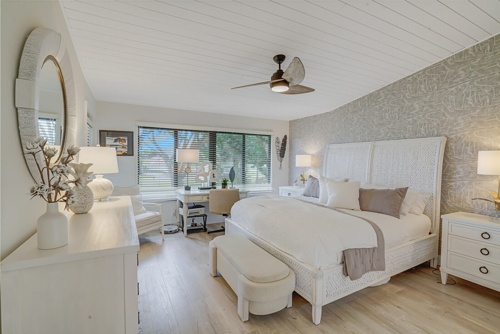 7527 Glendevon Lane, Unit 805 Delray Beach, FL 33446 - Photo 20 of 52 a bedroom with a large bed and wooden floor