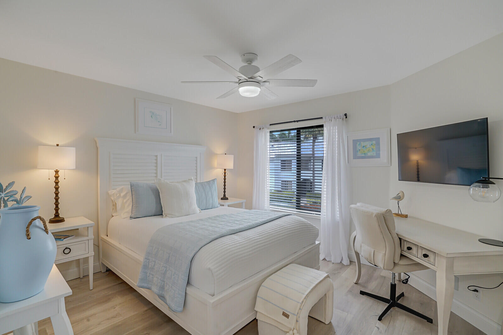 7527 Glendevon Lane, Unit 805 Delray Beach, FL 33446 - Photo 26 of 52 a bedroom with a bed and a flat screen tv